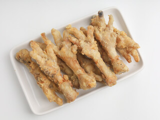 Fried chicken feet on white background