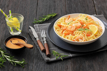 yummy spaghetti with shrimps in a white bowl