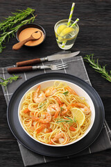 yummy spaghetti with shrimps in a white bowl