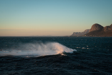 The waves of Africa and the distant mountains at dusk