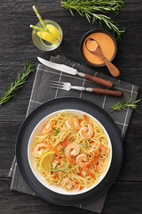 yummy spaghetti with shrimps in a white bowl