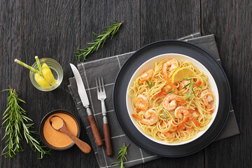yummy spaghetti with shrimps in a white bowl
