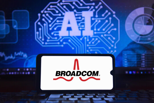 Broadcom logo on smartphone screen and artificial intelligence symbol in the background. Broadcom and OpenAI form an alliance to manufacture the next generation of AI accelerators.