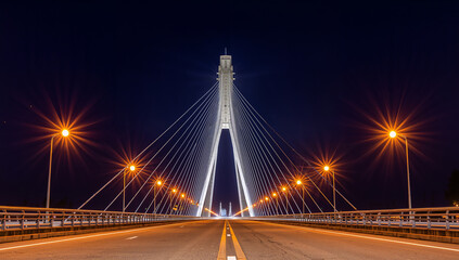 Obraz premium Vibrant Connections: Ingenious Bridge Illuminated at Night
