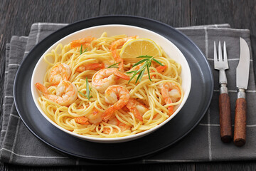 yummy spaghetti with shrimps in a white bowl