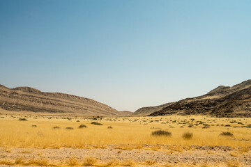 A stunning view of Gaub Pass in Namibia, showcasing the winding road through rugged desert mountains and arid landscapes