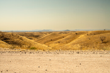 A stunning view of Gaub Pass in Namibia, showcasing the winding road through rugged desert mountains and arid landscapes