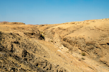 A stunning view of Gaub Pass in Namibia, showcasing the winding road through rugged desert mountains and arid landscapes