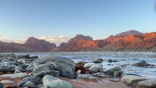 time-lapse of sunset over mountains and river in Tianshan Mysterious Grand Canyon, xinjiang, china