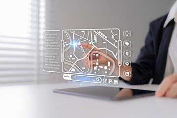 Professional hand uses futuristic interactive digital city map for urban navigation location search...