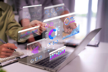 Business professionals analyze financial data using interactive holographic interface planning future strategy meeting collaboration office desk