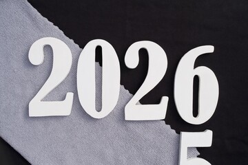 happy new years alphabet on black and gray background.