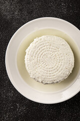 Cottage cheese fermented milk product portion size natural product tasty snack fresh delicious gourmet food background on the table rustic top view copy space keto and paleo diet
