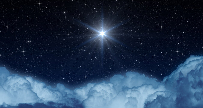 Glowing Star or Christmas Star over the Clouds Shines Brightly in the Starry Night Sky.