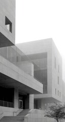 Modern concrete building architecture on a foggy day.