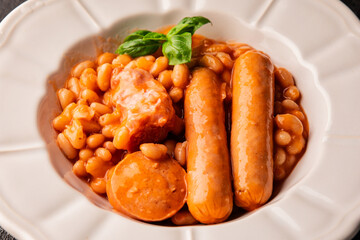 Cassoulet beans with meat and sausage french cuisine vegetables dish natural product tasty snack fresh delicious gourmet food background on the table rustic top view copy space