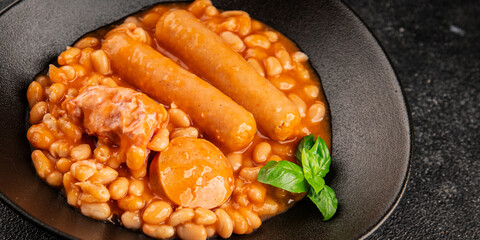 Cassoulet beans with meat and sausage french cuisine vegetables dish natural product tasty snack fresh delicious gourmet food background on the table rustic top view copy space
