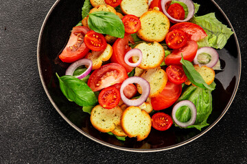 Panzanella salad tomato, croutons, onions vegetables dish natural product tasty snack fresh delicious gourmet food background on the table rustic top view copy space