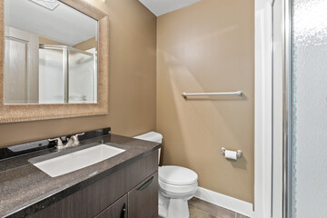 Bathroom with a white toilet and a sink