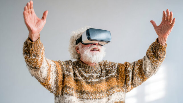 Senior man experiences joy while using virtual reality headset at home