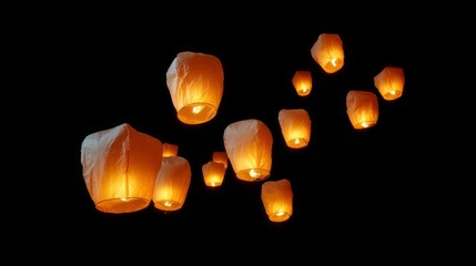 Fototapeta premium A bunch of lit candles are floating in the air