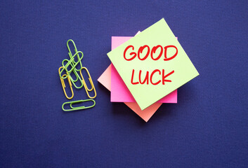 Good luck symbol. Good luck on sticky note. Beautiful deep blue background. Business and Good luck concept. Copy space.