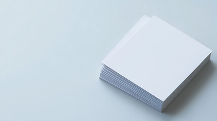 Stack of crisp, blank sheets of paper on a solid surface, ready for ideas and creation. Clean, bright, and inviting. Perfect for sketching or printing.