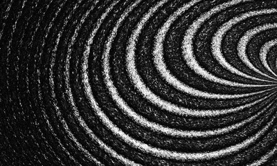 Abstract Black and White Concentric Circles Pattern with a Textured Feel creating dynamic effect