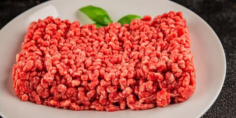 Raw minced meat beef pork ground meat natural product tasty snack fresh delicious gourmet food background on the table rustic top view copy space