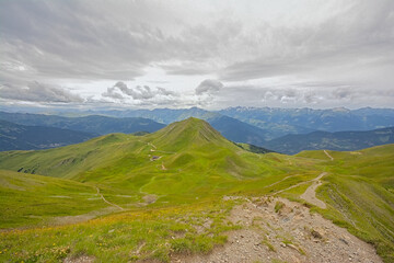 Fototapeta premium green mountain landscape under a cloudy sky in La Vanoise nature reserve, Savoie, France 