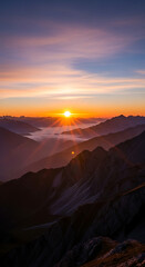 Naklejka premium Vibrant Sunrise Illuminates Majestic Mountains and Foggy Valley