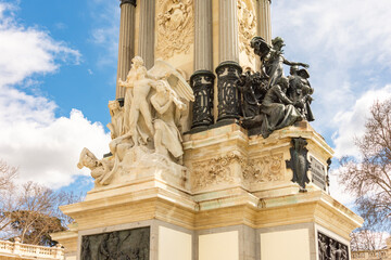 Obraz premium Sculptures at Monument to Alfonso XII in Buen Retiro park, Madrid, Spain