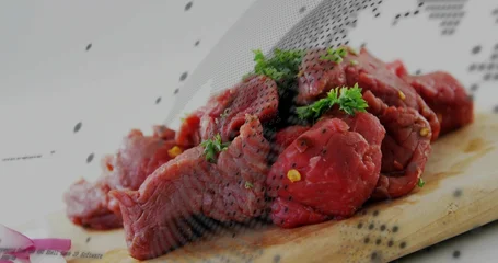 Fototapete Aroma Lying raw beef chunks on wooden cutting board in kitchen with parsley, cracked pepper, onion slices  © vectorfusionart
