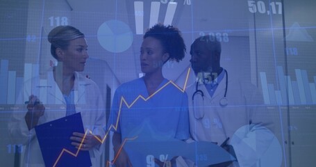 Examining charts clinicians in lab coats, scrubs in hospital corridor with digital data overlays