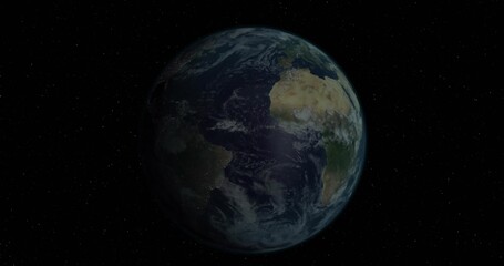 Obraz premium Floating blue planet Earth rotating slowly in vacuum of outer space, with distant stars