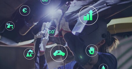 Operating gloved technician grinding chassis with grinder at workshop, with CO? and currency icons