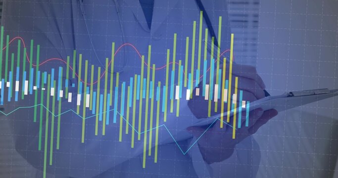 Analyzing executive in suit jacket annotating digital bar and line charts in office, with clipboard
