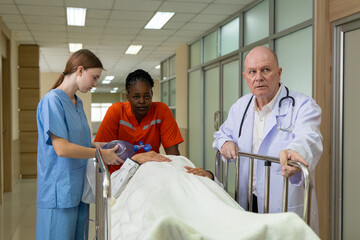 Emergency medical team rushing patient on stretcher