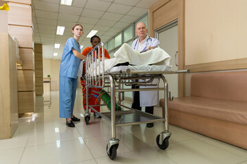 Emergency medical team rushing patient on stretcher