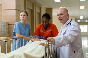 Emergency medical team rushing patient on stretcher
