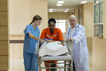 Emergency medical team rushing patient on stretcher
