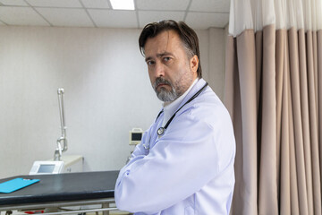 Confident medical team standing in hospital room