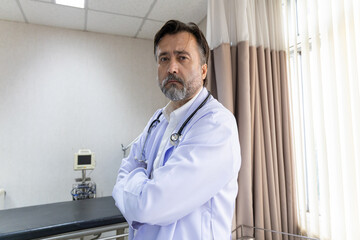 Confident medical team standing in hospital room