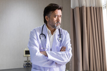 Confident medical team standing in hospital room