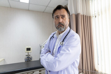 Confident medical team standing in hospital room