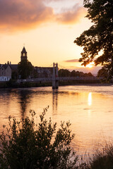 View to to river Ness footbridge in Inverness at sunset, Scottish cities, city break