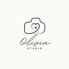 Charming handwritten photography studio logo with camera icon and sparkling heart design for creative brands