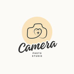 Charming camera logo design with heart and sparkle, perfect for a modern photo studio brand identity.