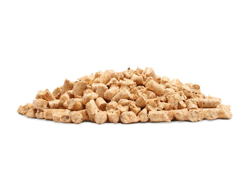 Pile of wood pellet cat litter. All-natural and eco-friendly alternative to clay litter. Also used as bio or fuel pellets for heating in stoves or furnaces. Pressed pine or softwood. Selective focus.