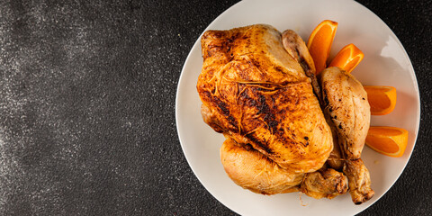 Baked chicken with oranges whole grilled chicken christmas holiday dish new year natural product tasty snack fresh delicious gourmet food background on the table rustic top view copy space